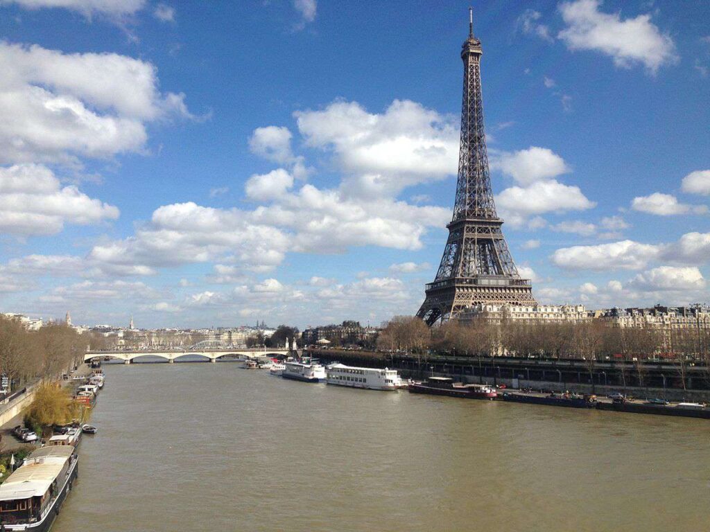 Eiffel Tower by the Seine river Paris 2 March 2014 569fd8b53df78cafda9e97bc