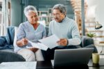 INV PeopleWorkingonRetirementPaperwork GettyImages 1139792604 9e4fcc9204d74729a800f071cd75d1da