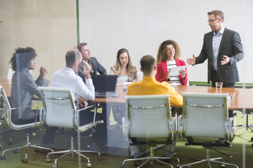 businessman leading a meeting in boardroom 748343073 8f7432b8511b49a7a4904702e95078a5
