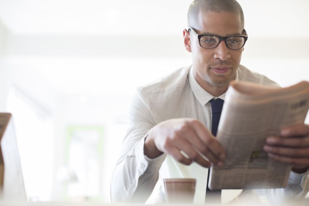 businessman reading newspaper at breakfast 478168541 59ca9b186f53ba00116e4fe8