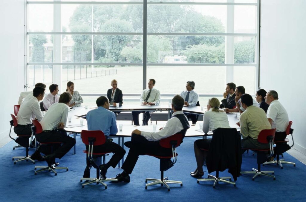 businessmen and women in meeting at large circular table 200335329 002 575241783df78c9b469b27f7