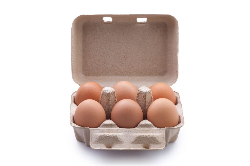 close up of brown eggs in carton over white background 950103504 86539c7626b84876a4abea39b91092e5.jp