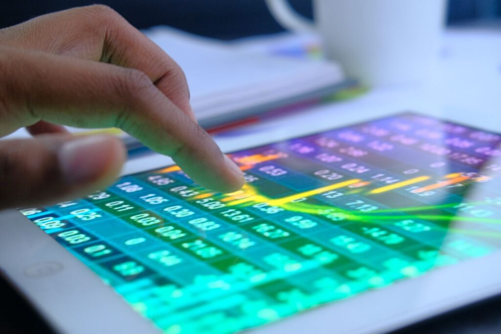 close up of man hand analyzing stock market chart 1023021802 97572d048e634868b75435366741e42d