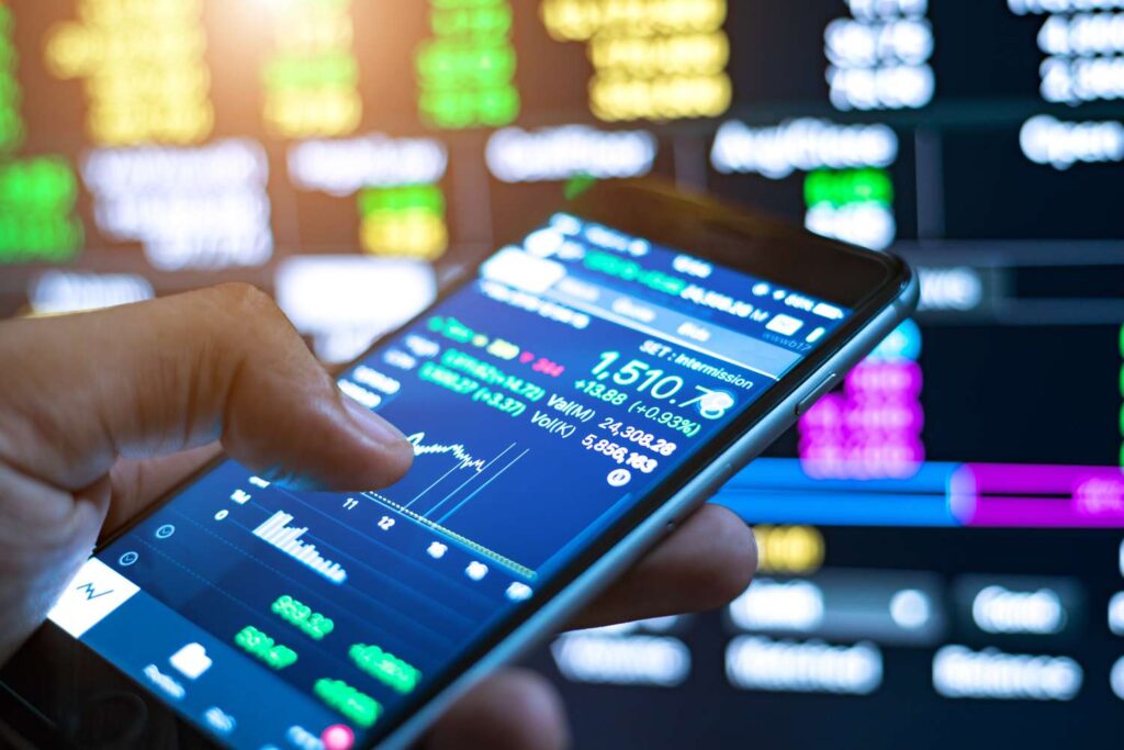 cropped image of man checking stock market on mobile phone 1051266664 0cefdf912d014106bc5338cda5999f