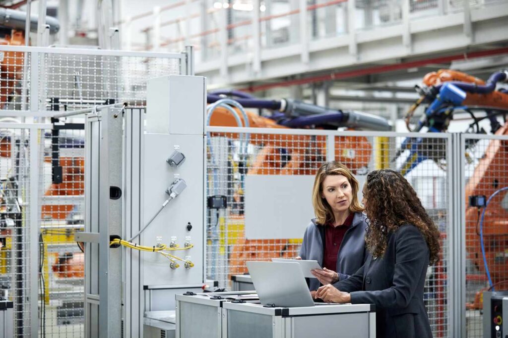 female engineers using technologies in car plant 1076609538 bb4dcf72d0a4401fb3e46d90bb23cf0e