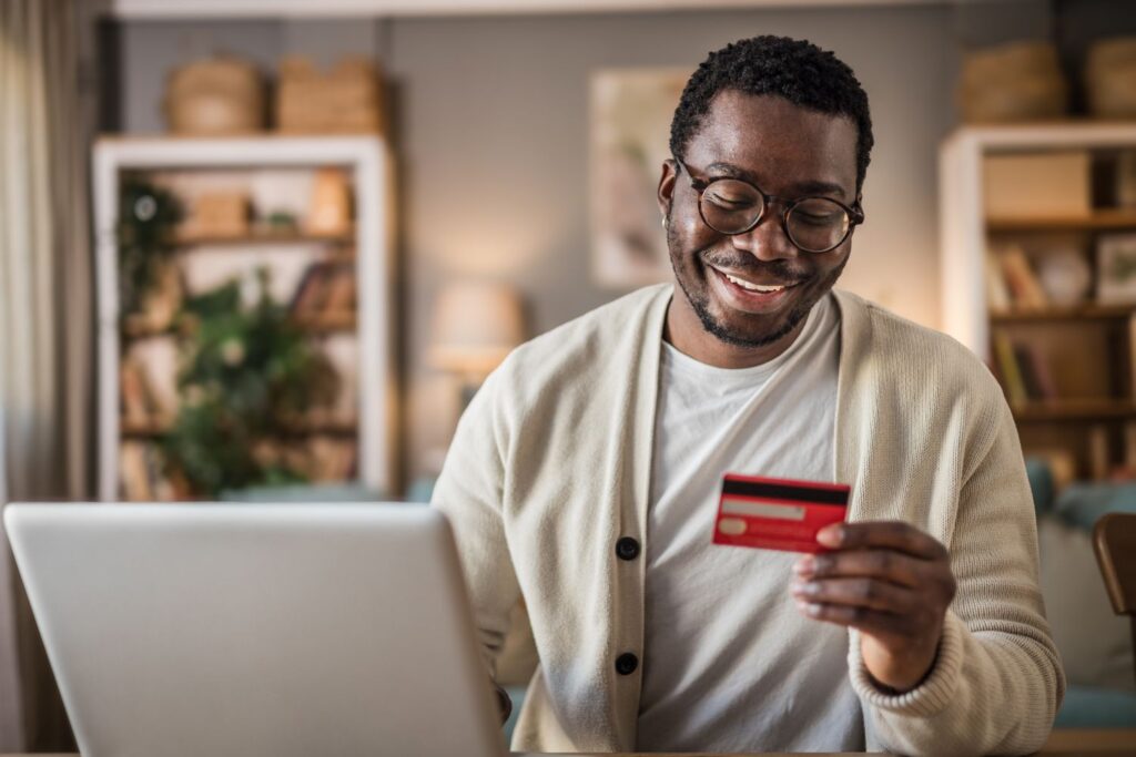 happyyoungmanusingonlinebanking 6a973c23cf924ed8b509a2c84fe713a5