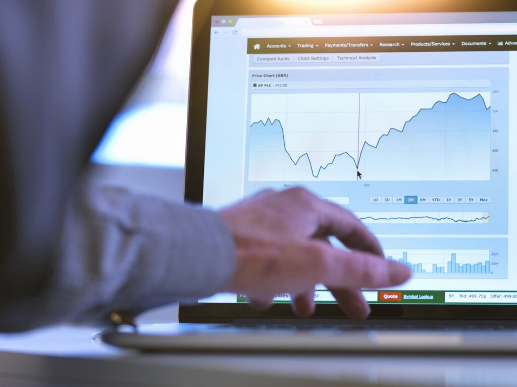 investor viewing company share price market data on a laptop computer 713768437 c4eda9ee28224ad6be4f
