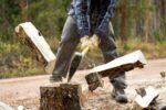man splitting log in half for fire wood with ax 107856393 5ab6b8b6fa6bcc0036d0692f