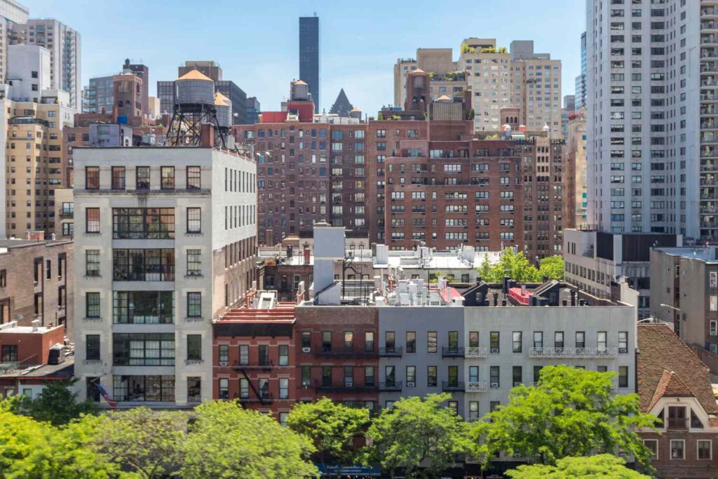 new york city overhead view of historic buildings along 59th street with the midtown manhattan sky