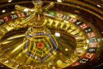 shining spinning golden casino roulette gambling and casino equipment conceptual background 17780848