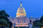 summer night at capitol hill a dusk view of west side of the u s capitol building as a small cro