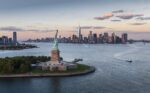 usa new york state new york city aerial view of city with statue of liberty at sunset 539667859 8
